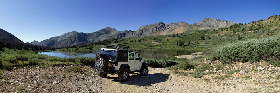 4-wheel vehicle near mountain lake
